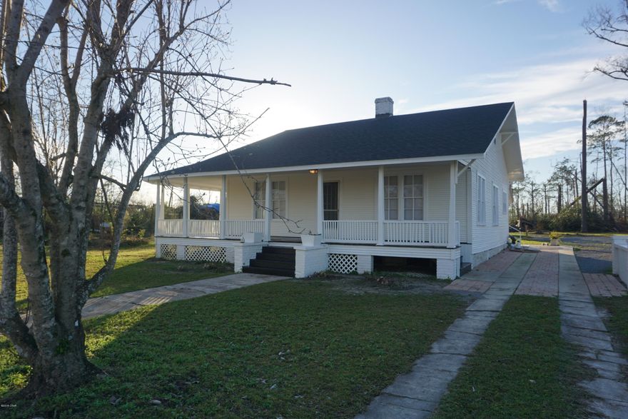 11.26 Acre Hobby Farm 1 mile S of Historic Downtown Marianna. This beautiful home built in 1916, features 3 bedrooms, 1.5 bath with  10 ft ceilings, wrap around porch, original hardwood floors, fireplaces and updated kitchen & baths. Other improvements include new roof, hvac, gas water heater, appliances, new fixtures, tile in the kitchen & bath, & fresh paint. The property also features a separate 675 sq ft apartment with bedroom, bathroom, living area, & kitchenette perfect for out of town guests or a rental. Land is cleared around the house, but otherwise wooded. Being Sold ''As Is