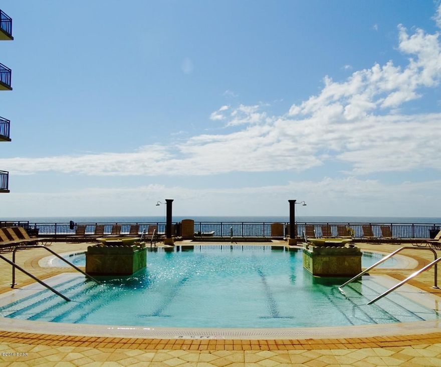 One of a kind beach getaway retreat with gulf view & pool view; direct pool access from condo and electric fireplace to enjoy.  Looking for a vacation retreat to relax in this is it; looking for an investment property, you have found it.  This one bedroom retreat has the capacity to sleep six, with the pull out murphy bed discreetly tucked away on exterior wall.  Extra storage space in the bathroom and brand new memory foam mattress on the master bed. This MUST SEE unit is located in the popular Origin At Seahaven, just across the street from the gulf and Sharkey's; close to Pier Park with shopping and restaurants. Origin complex offers motor court entrance with covered parking, nice lobby area and corridors; grand terrace with zero entry pool as well as hot tub located on the 4th floo