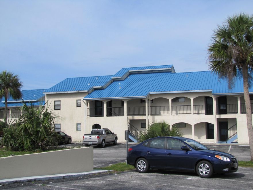 Looking for a place on the water?  Look no further.  This well taken care of 2 bedroom 2 bath end unit condo is ready, just line up the moving truck.  The unit conveys with boat slip # 9. The master bedroom faces the water.  Spacious living room with wood laminate flooring. Breakfast bar, bar stools convey.  Good sized kitchen with lots of cabinets, solid surface counter tops, stainless steel stove and refrigerator.  Stacked washer and dryer are in the pantry off the kitchen.  2013 AC was replaced inside and out and comes with a transferable warranty.   Across the street from Earl Gilbert Park.  At the end of the road there is public parking and a boat ramp.  Call your favorite Realtor to view this lovely unit.