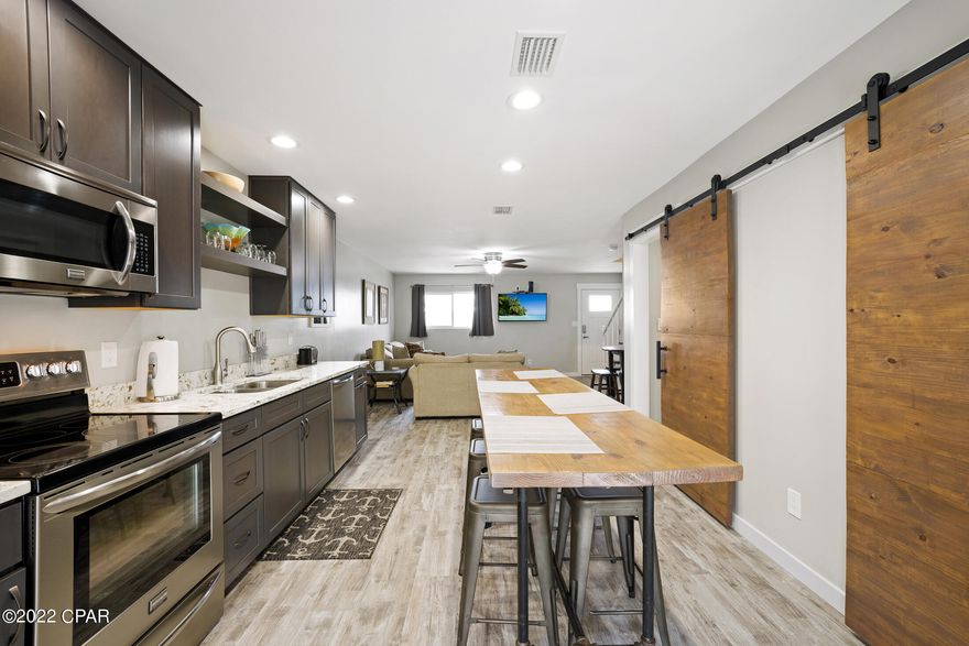 Across the street from the white, sands of the Gulf of Mexico!

Wendwood units are rare!ly available ;nicely maintained, small complex no association and you own the land! Gorgeously renovated, turnkey, fully furnished  townhome and fully prepped for vacation rental! Rental projection is $30-$40K! You have two deeded parking spaces! This beautiful townhome has recess lighting, quartz countertops, tankless water heater, & LVP flooring. French doors open up to your deck. Master bedroom and second bedroom each have their own balcony! There is a full bath downstairs just inside the back door. Very convenient for those beach days! There is an Optional Community Amenities Agreement which allow the use of the pool, clubhouse, trash, cable & internet for only $391.52 a quarter.