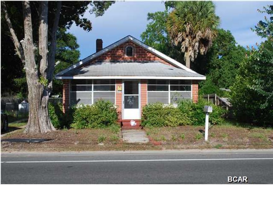 St. Andrews-residential/ commercial- work from your home office. This home features 2br/1ba with new windows. The property has large oak tree, palms, magnolias and more. This location is convenient to everything. Property location is zoned residential/ commercial. It will make a great office, just a few blocks from hwy 98. Carport located at the rear of the house, along with separate outside storage/workshop building. Easy to show. Seller will look at all offers. Age, SF Lot and room sizes are approximate. Please verify if important.