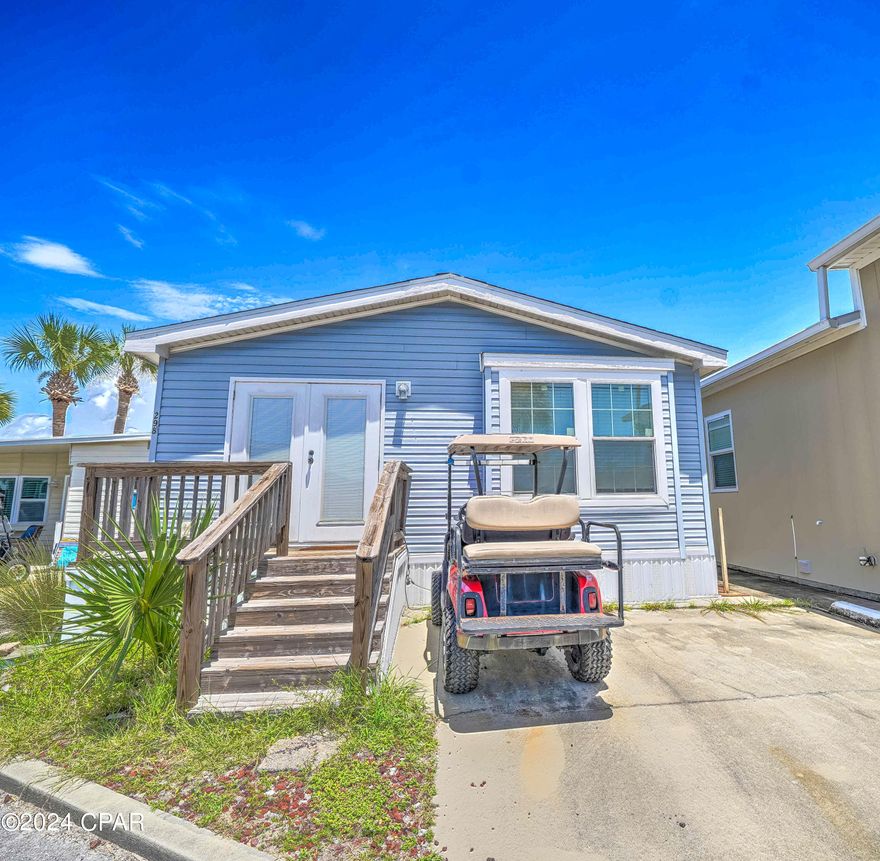 CURRENTLY UNDER CONTRACT, SELLER WILL CONSIDER BACKUP OFFERS - Check out this 2 bedroom, 2 bath Venture Out home.  Great open floor plan with nice size rooms throughout. Tons of potential here! Make this your vacation home or investment opportunity!    Venture Out is a golf cart community that has exploded with popularity recently... With 300' on the beautiful pristine beaches of the Gulf of Mexico and 1,000' on the Grand Lagoon. Venture Out has something for everyone.