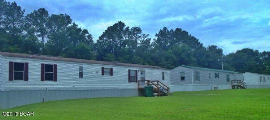 INVESTORS!! 100% occupied!!! This property has two duplexes and three single wide manufactured homes. Income generation at present time is $3300.00 per month. The owner has taken a lot of pride in the upkeep of these rentals. The duplexes are 2/1 with washer/drier hookups. Two of the manufactured homes are 2/2 and one is 2/1. All units have HVAC. Mechanical and lawn maintenance can still be available after purchase. Jackson Correctional Institute provides jobs for hundreds of personnel in Malone and vacancies rarely occur. Please call listing agent to see each unit!!