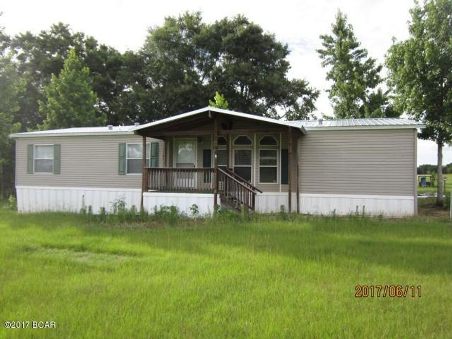 One acre, more or less, part of parcel numbered above, and will be surveyed from that parcel.  Land is cleared and fenced, but is surrounded by pastureland. There are several shade trees growing around perimeter of home and nice views of rolling pastures behind and to the side of the home.  Home features front and rear porches, a foundation in the yard for a yard building (former one torn down).  Three bedrooms, two baths, eat-in kitchen and separate dining area,  home in excellent condition for age.  Up to 9 acres additional land available for negotiated price.