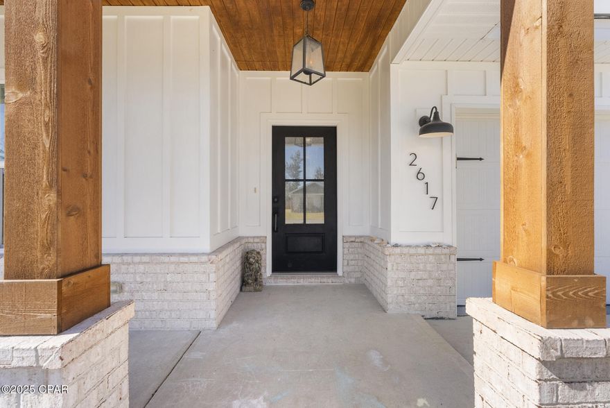 Located in the heart of Panama City, this 2022 Outlaw-built home delivers modern construction, quality finishes, and exceptional convenience. Just minutes to Tyndall Air Force Base, major shopping and dining along 23rd Street, HCA Florida Gulf Coast Hospital, and a short drive to Panama City Beach.

Built in 2022, this 4-bedroom, 2-bath residence offers a functional open layout with 9-foot ceilings and thoughtful upgrades throughout. The fourth bedroom features double doors and works perfectly as a home office or flex space.

The kitchen is designed for both everyday living and entertaining, featuring ceiling-height custom cabinetry, quartz countertops, an oversized island, tile backsplash, walk-in pantry, and upgraded stainless steel appliances including the refrigerator.
Crown molding accents the main living areas, and the Great Room showcases a tray ceiling for added architectural detail.

The primary suite includes a double vanity, garden tub, separate shower with built-in seat, and a spacious walk-in closet. French doors with built-in blinds open to a covered rear porch overlooking a landscaped yard complete with irrigation, fruit trees, and storage shed.

Additional highlights include waterproof luxury vinyl plank flooring throughout, LED recessed lighting, upgraded fixtures, ceiling fans, and a garage pre-wired for electric vehicle charging.

Assumable VA loan available for qualified buyers, offering a potential financing advantage.
Seller is open to reviewing all serious offers.