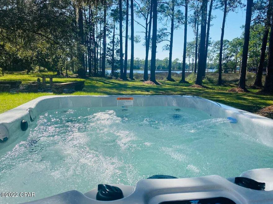UNDER CONTRACT, SELLER WILL CONSIDER BACKUP OFFERS!

WOW! Beautiful renovated home on the Intracoastal waterway! 3 private acres all to yourself in PCB! 12 minutes to Pier Park & the beach, 10 to shopping, secluded & private!

Turn key & ready to go!!

Live in it or use it as a short-term rental! Home is currently STR, it's already made $44K this year! Projected at $60K by the end of 2022.

Home has a brand new dock & is fully renovated, with a beautiful custom kitchen, bathrooms, and gorgeous sun room with 2 walls of sliding glass doors.

With a hot tub, fire pit, pole barn, and massive garage, this home captures Florida's wildlife in the outdoors. Soak in the hot tub and enjoy the breathtaking views of the open water... this home is a dream come true!
Call your agent to see today!