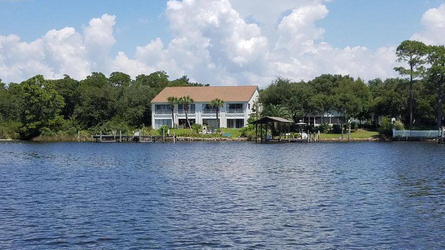 Here is your chance to strike another item from the ''Bucket List''- This is a rare ground floor waterfront unit facing the beautiful Grand Lagoon. The shared dock is a few steps away and who wouldn't love to boat to Shell Island or to St Andrews State Park in less than 5 minutes? This also means you can drive a car to the beach in about the same amount of time. Make it a permanent residence, an investment property or a second home. Your call, but don't complain if you miss it! 1 

regular Bedroom, 1 Bunk room (or office) with the closet across from the entrance and a 5 x 11 bathroom make this 944 sq ft unit just right. Did I mention it is affordable?