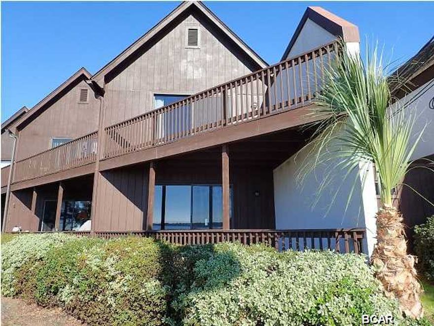 Take this opportunity to own this 2 bedroom 2.5 bath corner unit townhome with spectacular views of St. Andrew Bay. Located on historic Beach Dr. this townhome has unobstructed views of Redfish Point, Shell Island and the Pass! Sit and watch the boats go by from either of your 2 private balconies. Just a GREAT location, directly across from St. Andrew Bay, in a pedestrian friendly neighborhood. Just .3 mile to downtown Panama City. Stroll to restaurants, entertainment, fish markets and the Panama City Marina or taking a relaxing and scenic walk on Beach Dr. Both decks on the upper and lower balconies were recently replaced, the interior walls and ceilings have been recently painted. The floor plan is open and spacious with water views from the kitchen and living room as soon as you