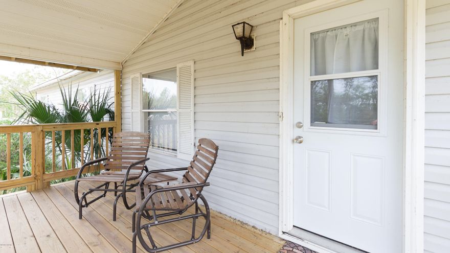 While sitting on your large front porch you will be able to enjoy the cool shade of your oak trees and the quiet of this country living. This home also has a very large back and side porch that would be great for entertaining or grilling out. This home sits on a very large lot if you wanted to add a pool or additional out buildings. Inside you will find a very large open floor plan, large living room, kitchen and dining space with fire place. In the master you will find a very large walk in closet, loads of natural light from the skylight over the large soaking garden tub next to a stand-up shower and double sink vanity. In the 2 additional bedrooms you will notice plenty of space with lots of storage. Through out this home you will find easy to clean flooring and low maintenance..... .....Landscaping. All appliances in the home stay without warranty along with a lawnmower in the huge metal 15x15 out building that has power and would make a fantastic work shop or storage space!