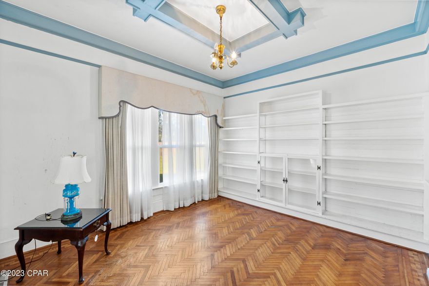 Welcome to this magnificent historic home, situated on 1.47 acres of land. Built in 1916, this timeless gem boasts 3,121 square feet of living space, offering plenty of room for entertaining. With four generously-sized bedrooms, it's the perfect blend of historic charm. The home features parquet floors that add to its character. Inside, you'll find a spacious sitting room and a formal dining room that's ideal for hosting gatherings and special occasions. Additionally, there's a den that offers a versatile space for work or relaxation. This property also includes a nice storage building with electricity, providing added convenience and functionality. With a rich history and the potential to become a showpiece with some updating, this home also features a newer metal roof, ensuring durability and protection for years to come. Conveniently located on a paved road near local shopping and dining, you'll have everything you need at your fingertips.