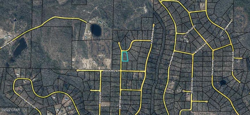 This is a large 1.1 acre wooded corner lot in the Compass Lake subdivision. Compass Lake (see pic)is an all-sports lake, offering water skiing, tubing, jet skiing, pontooning, power boating, sailing, wakeboarding, canoeing, kayaking and swimming. In keeping with its reputation as a boating lake, a restaurant along the shore is accessible by boat. Most of the shoreline provides a natural sand beach. Located about half-way between Panama City, FL and Dothan, AL, Compass Lake is only 10 miles from Marianna and Interstate 10. The area is rich in historical significance, with many restored antebellum plantation homes open for tours or as bed-and-breakfasts. Nearby Alford holds a grocery store and some basic services, while Marianna contains nearly everything a resident would need. About 30 mile south, Panama City Beach offers public Gulf beaches and marinas for 'big water' boating plus big-city amenities and attractions. The entire area around Compass Lake is filled with unique geological treasures, some of which are state parks. Two well-known attractions near Chipley, Falling Waters State Park and Caverns State Park, both display in spectacular fashion the effect of eons of water flowing across the ancient limestone.