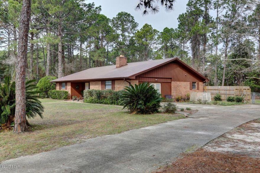 Wonderful 3 bedroom 3 bath home, situated on 1+ acre of land just minutes from the Naval Coastal Systems Center.  If you appreciate the outdoors and value your privacy this home is for  you.  Home offers a spacious living room with a lovely Bay window and fireplace to enjoy on chilly nights, nice size dining room which will easily accommodate large table and hutch, plenty of storage, three generous bedrooms, and a comfortable Florida room with nice size windows allowing for plenty of natural sunlight. The cook in the family will enjoy the eat in kitchen which has plenty of counter and cabinet making it a perfect place for family meals.  This home has been well maintained and is not in a flood zone and has a new metal roof. Pride in ownership shows in this home.  Call for your private showing today.  All ages, sizes including sq. ft. are approximate measure if important.