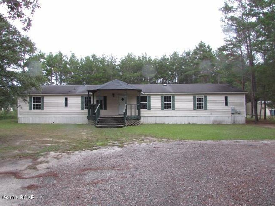 Large doublewide offers front and rear porches, huge living/dining area adjoining a large kitchen w/all appliances and breakfast area, a family room w/sliding glass doors opening to the rear porch, split-planned master suite w/walk-in closet, small bonus area, and full bathroom, and 3 more spacious bedrooms. Secluded location convenient to Ebro, Southport, Vicksburg, Youngstown, and Fountain. EQUAL HOUSING OPPORTUNITY!