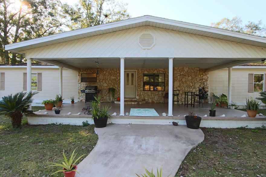 This is your chance to live in Howard Creek!  This beautiful home is minutes from the boat launch.  Situated on a half acre lot, this 4 bedroom 2.5 bath home has plenty of room for full time residents or just a weekend retreat.  The spacious kitchen features a pantry and newer GE appliances. The living room becomes very cozy with a stone wood burning fireplace for those crisp winter nights.   Through the French doors is an enormous sunroom.  The luxury master suite includes a walk-in dressing closet while the master bath has a jetted tub, separate shower and double vanity.  The extra long driveway leads to the 2 car garage for plenty of boat, car and RV parking.  Bring your boat and fishing gear and enjoy all of the amenities Howard Creek has to offer!