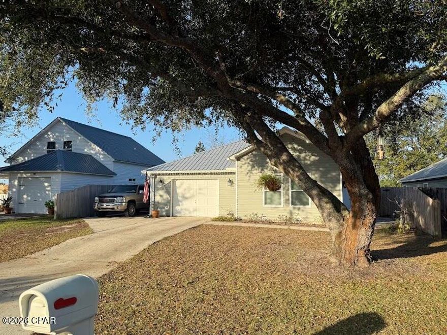 Welcome to this beautiful 3-bedroom, 2-bathroom home located in Panama City, FL. This property is nestled in the charming neighborhood of Sweet Water Village, offering a sense of community and convenience. The home features a spacious two-car garage with a single garage door access, perfect for vehicle storage or a workshop. The fenced backyard provides a private space for outdoor activities, while the covered back porch is ideal for relaxing or entertaining guests. Situated in a cul-de-sac, this home offers a unique blend of privacy and accessibility. Experience the perfect blend of comfort and convenience in this Panama City gem. All property sizes and ages are approximate, please measure and/or verify if important. School assignments are subject to change, please check with Bay County for most accurate information. Deposit is the same as the rent. Pets allowed. Breed restrictions apply with owner approval only.