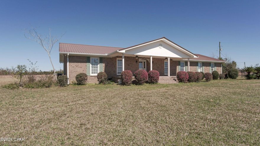 'CURRENTLY UNDER CONTRACT, SELLER WILL CONSIDER BACKUP OFFERS'S Welcome to 16668 NE Hanna Tower Rd! This beautiful 3BR 2BA brick 2822 sqft. home is situated on a lush 3 acre corner lot with a paved road on 2 sides and city water/sewer. It will make the perfect place for a large or multi-family. Special features to mention are a spacious pantry, custom cabinets, granite countertops, fresh paint, recessed lighting, crown molding, large living and dining area, beautiful hardwood flooring, a built-in desk, a Florida Room, a 21.5x33 Bonus Room with so much potential and storage space galore. The master suite is very roomy featuring a double vanity, walk in closet and custom shower. The other 2 bedrooms are an adequate size. The yard has a fenced in area with a 26x60 pole barn, additional power pole and a concrete driveway. You could even have your very own mini farm. Conveniently located approximately 15 minutes from Marianna, an hour from Panama City, Tallahassee and Dothan, AL. Don't let this one slip away. Call your favorite Realtor today to schedule a showing. Measurements are approximate. Verify if important.