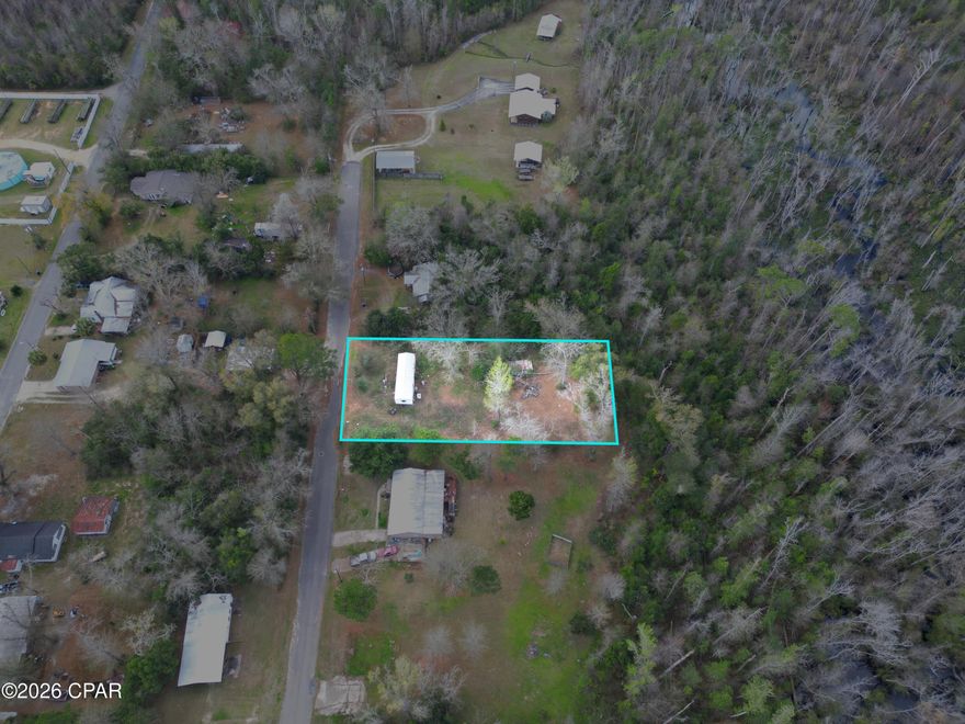 0.67 acres • City utilities available • Paved frontage • No HOA • Partially cleared • Shed • McClellan Subdivision

Set in the City of Blountstown with a Blountstown mailing address, this approx. 0.67-acre vacant residential parcel offers paved road frontage and city utilities available. The property at 20237 NW McClellan Ave includes Lots 5 and 6 in McClellan Subdivision, giving you a practical in-town setting with room to plan your next use. The lot is partially cleared, which helps show the shape of the land while still leaving natural cover in place. A shed is located on the property for added storage potential. No HOA gives added flexibility for future plans, subject to city and county requirements. Nearby everyday stops include Piggly Wiggly, Blountstown Drugs, McDonald's, and the Blountstown Public Library, all within a short drive. Existing trailer on site is considered of no value and is not included as a contributing improvement. Buyer to verify zoning, utility connections, building requirements, lot dimensions, and any permitting needs.