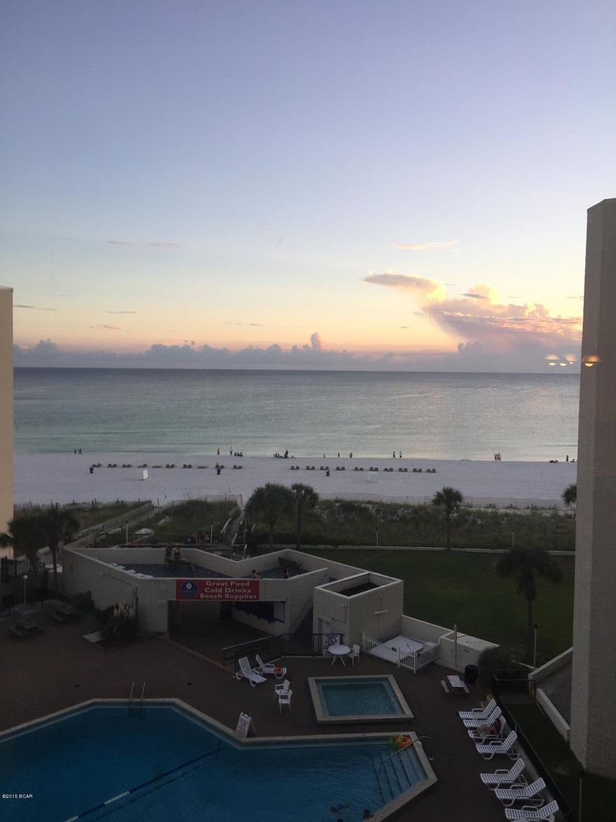 This unit is so adorable.  In great condition with updated cabinets, flooring and kitchen.  Tile throughout with walk in closet.  Unit located next to a large breezeway to sit and watch the gulf.  Coin operated washer and dryer near this unit as well.  Awesome view of the gulf, white sandy beaches, large pool and deck.

Come and buy this piece of paradise!