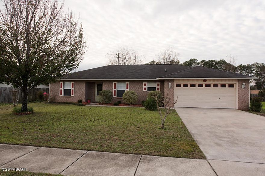 This freshly painted, all brick 3 bedroom, 2 bath home is move in ready! Home features a large living room with fireplace, formal dining room, beautiful laminate flooring, split bedrooms, and a laundry room (not a closet - with extra storage space!). Kitchen has ample cabinetry, pantry, and opens to living room. The master bedroom has a built in vanity area, master bathroom has large his and hers closets, double vanity, shower, and linen closet. There is a screened in patio outside off of the kitchen and a large workshop with electricity in the backyard, there is a covered are in front of the workshop for gatherings with a swing that will convey! All sizes/info are approx, please verify if important.