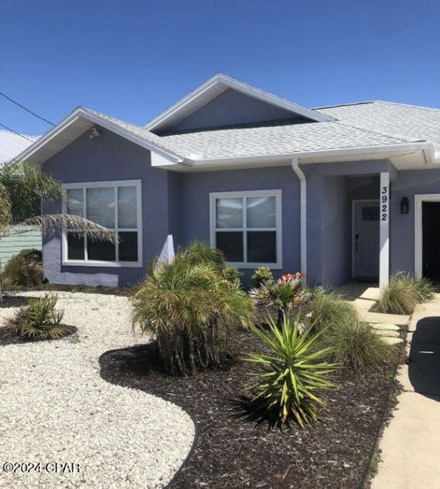 Located just minutes from the pristine white sand beaches and NO HOA! This beautiful 3 bedroom, 2 bath Beach House is near Beach Access #16 and Rick Seltzer Park. It is offered fully furnished, for immediate short term rental income or your personal beach home.  It can accommodate up to 8-10 people. Entering the house, you will immediately notice the spacious open living area with 9' ceilings. Flooring is LVP and tile for easy cleaning. The kitchen has stainless steel appliances and also equipped with kitchen items such as pots &  pans, plates, glasses, etc. The laundry is located in the garage, the washer and dryer do convey. The lawn is low maintenance and has a fenced back yard along with a covered patio. Short term rentals allowed in this area, no HOA and flood zone X.  The roof is approximately 3 years old.  Call your favorite Realtor for times this home can be viewed.  All sizes are approximate, buyer to verify if important.