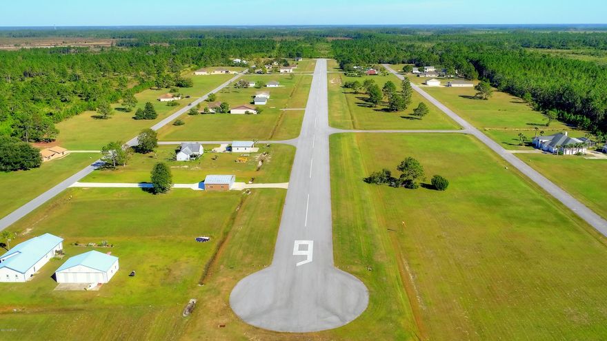 Off runway lot for sale at Sandy Creek airpark. on of the larger lots 150 ft of road frontage. This lot does have a survey, and has a small pond on north corner.