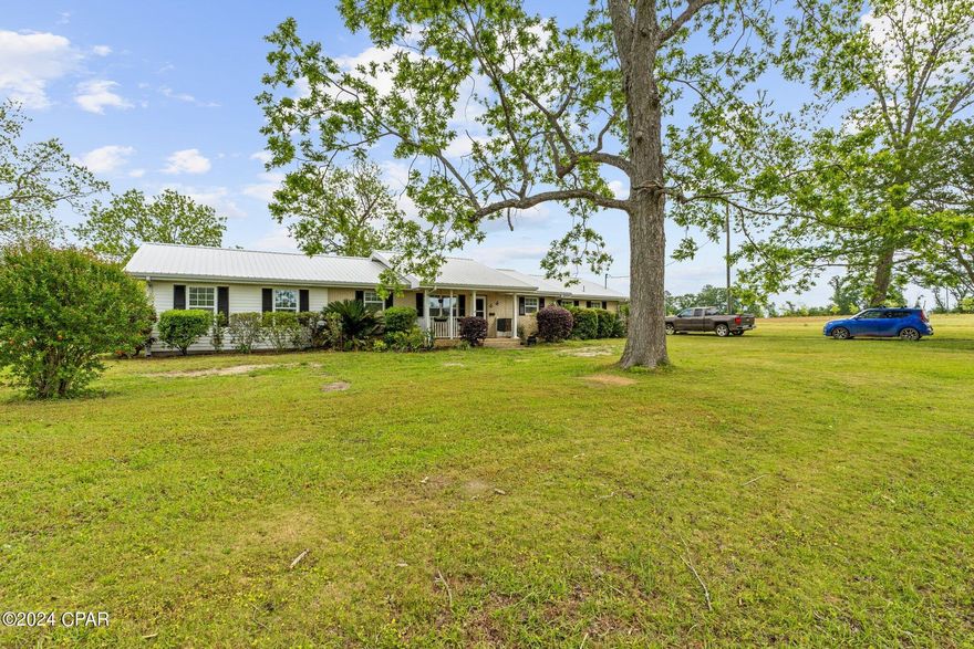 'CURRENTLY UNDER CONTRACT, SELLER WILL CONSIDER BACKUP OFFERS' 
Welcome to your dream home! Nestled on 4 acres, this spacious brick residence boasts 5 bedrooms, 2 bathrooms, and a prime location just a mile off of Hwy 79. Less than an hour away, you'll find yourself lounging on the stunning beaches of the Panhandle. Experience the charm of hardwood floors throughout, complemented by numerous updates including new countertops and appliances in the kitchen. The master bathroom is a sanctuary with a generous walk-in shower, offering a touch of luxury to your daily routine. This property is equipped with modern amenities, featuring a new well pump and roof, ensuring peace of mind for years to come. Entertain guests or relax in style within the screened-in pool area, ideal for enjoying Florida's warm summers. Conveniently situated near Holmes Creek and Cypress Springs, outdoor adventures are just moments away. Don't miss the opportunity to make this your forever home - schedule a showing today!