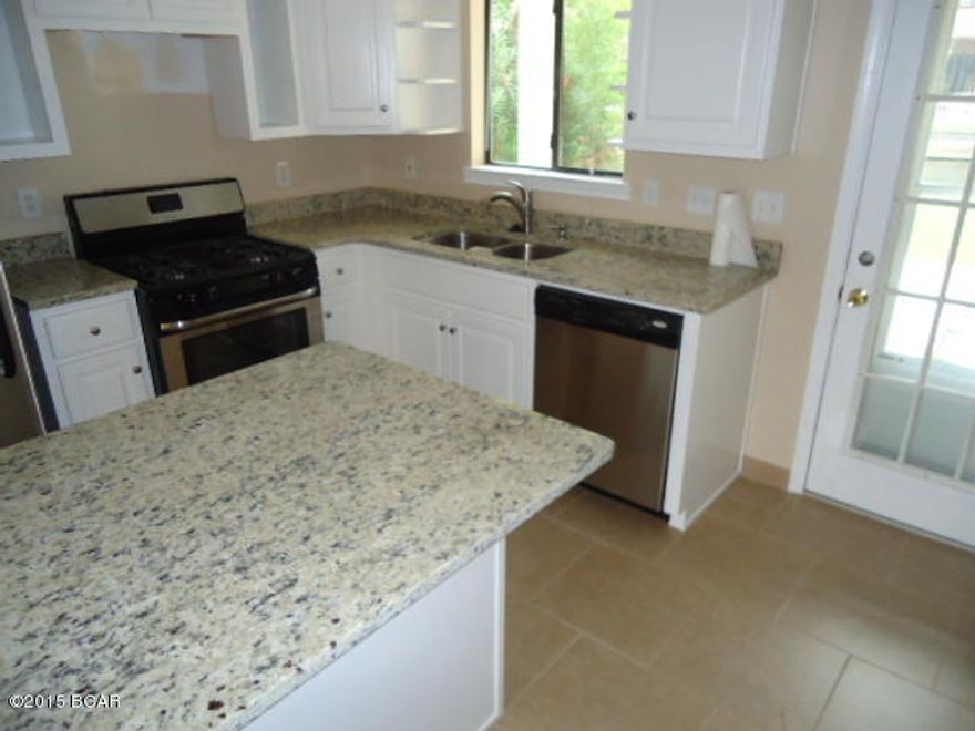 Age, SF, and dimensions approximate. Beautifully renovated unit on the canal. All new kitchen appliances and cabinets. Granite counter tops. New roof. New tile downstairs and laminate flooring upstairs. A must see!!