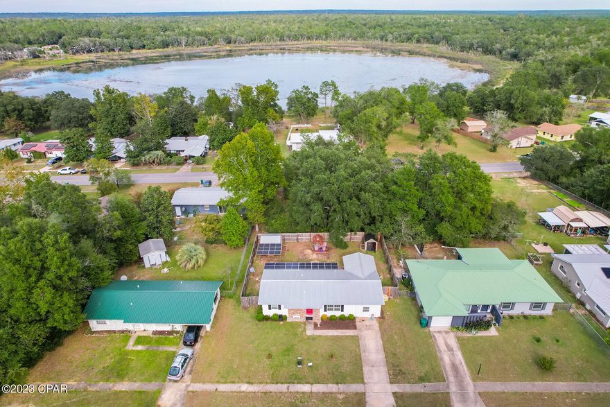CURRENTLY UNDER CONTRACT, SELLER WILL CONSIDER BACK UP OFFERS. 
Introducing a charming three-bedroom, one-and-a-half-bathroom residence in the heart of Chipley, Florida, freshly listed and brimming with conservation-conscious upgrades. This home boasts not one, but two solar systems, Energy Star-certified appliances, and energy-efficient double-pane windows, making it an ideal choice for budget-conscious buyers. Additionally, this property offers a host of modern amenities, including a comprehensive security camera setup, a cell phone signal booster, dual directional antennas, Starlink Internet service and a cutting-edge Ring doorbell camera system. Inside, you'll find gorgeous custom wood cabinets and luxurious granite countertops, complemented by generously spacious closets. Outdoor enthusiasts will appreciate the included storage building, shed and a covered deck, perfect for unwinding in the Florida sunshine.  Sunny Hills is a wonderful community that includes many outdoor amenities such as a golf course, swimming, fishing and is a quick 35 minute drive to Panama City! This home is a remarkable find for those seeking both comfort and sustainability. Home currently has an active termite bond.