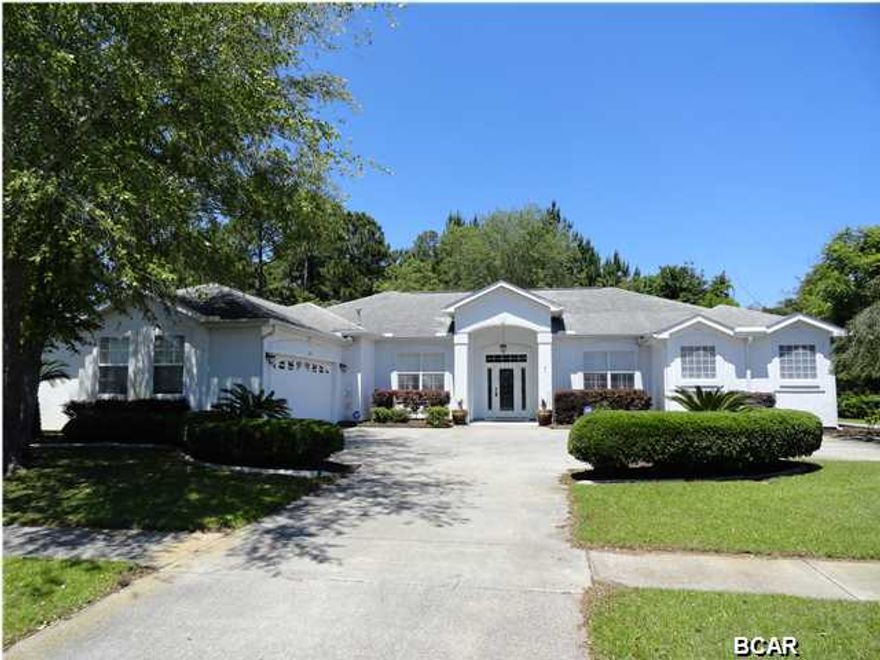 *** POOL HOME *** This 4 bed 3 bath plus office 2,573sf home with in-ground screened in pool is centrally located and perfect for entertaining. WoodRun is a smaller, quiet neighborhood and one of the best in Lynn Haven. This home is set on the perfect lot for tranquility and privacy. It has green space all along the back and the right of the home. The home itself is full of upgrades from the double crown molding, plantation shutters, built in book shelves, built in breakfast nook, security system and hardwired smoke detectors. Having four bedrooms plus a true office gives plenty of room. The house is a three way split plan with a guest bedroom and bath off the great room, while the other two guest rooms share a jack and jill bathroom and are off the dining room. The Master bedroom has a do