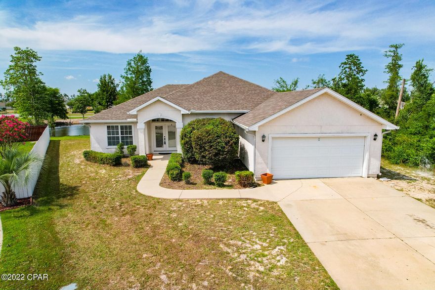 Perfect home on a cul-de-sac and pond out back with a quiet conservation area next to the home. Open and bright with new carpeting throughout, new interior paint throughout, new garage door 2020, AC 2021, disposal 2022, oven/dishwasher/microwave 2017 in this 4 bed/2 bath home located in The Hammocks subdivision. As you enter you can see to the pond out back. The open floor plan boasts great entertaining spaces with split bedroom floor plan. The main bedroom en suite is quite large featuring a double vanity, whirlpool tub, separate shower and walk-in closet. This is a perfect home to provide extra space for your needs. Enjoy the community pool - all the fun and none of the maintenance! Buyer to verify measurements if important