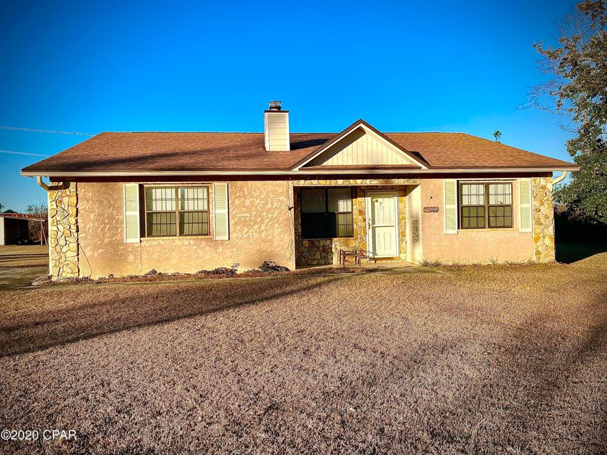 This spacious three-bedroom, two-bath, split floor plan home is situated on a paved road in a quiet neighborhood just on the edge of town and 5 minutes from Interstate 10.  The 1842 square foot house boasts custom, solid wood kitchen cabinetry, large closets, and a sprawling 1.6 acre lot.  It is complimented by a large out-building and an in-ground swimming pool.  The property is surrounded on all sides by trees and greenery, providing for ample privacy.  Major maintenance is covered for years to come since the roof and pool liner were replaced in 2018 and the HVAC system was upgraded in 2015.  This country haven awaits!