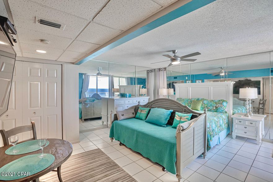 Under contract — seller accepting back ups. OPEN the DOOR to your BRIGHT and HAPPY at Long Beach Resort. This quiet and LIGHT-FILLED END unit is beautifully furnished and includes a KING-sized bed, large-screened TV, and a kitchen that has been creatively reinvented! with new appliances, a GENEROUS PANTRY with soft-close doors, GLASS front cabinets, GRANITE countertops, and custom GLASS with mother of pearl backsplash. Also included is a washer/dryer. This GATED, GULF FRONT well-manicured property with generous parking area creates a low-density setting that places you within walking distance of popular dining, shopping, attractions, and the SUGAR SHORE of our INCREDIBLE BEACH. On-site amenities include exercise room, 3 POOLS, a beachside grill, hot tubs ...