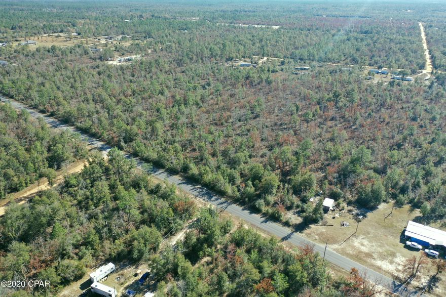 This 10-acre wooded parcel is perfect for your dream home in the country! Vacant land on a newly paved road, this undeveloped, uncleared land is full of possibilities. Just north of Panama City and only 20 miles from I-10, this location is prime to have privacy but still be near what you need. Hiking and trail enthusiasts, this property is only 1.7 miles from the Scott Road trailhead, a well-known 16 mile hiking and horse riding trail full of elevation changes and wild flowers. The property is easily accessible just off of Hwy 231. Go see this vacant land and make your dreams a reality of owning a piece of paradise in the country. *Buyer to verify all measurements, if important.*