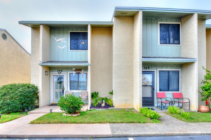 CURRENTLY UNDER CONTRACT, SELLER ACCEPTING BACKUP OFFERSLIVE THE DREAM! AFFORDABLE LIVING by the GULF OF MEXICO in this beautiful gated community and very low HOA fees!!! This unit is directly across from pool, tennis courts and playgrounds! This is an END UNIT, and larger than most, as the owners turned the balcony on 2nd floor into a bonus room and added an additional 4ft, variance approved and all permitted work! The kitchen has solid wood cabinets with pull-out shelving, and a lazy-susan in the corner, granite countertops! Natural Gas stove and HVAC. This Gated Community is Golf Cart friendly so you can drive and park by the stop light controlled crosswalk to the Beach-Front Pool and Recreation Building, or choose from the other 10 Swimming Pools within the complex (5 heated), Lighted