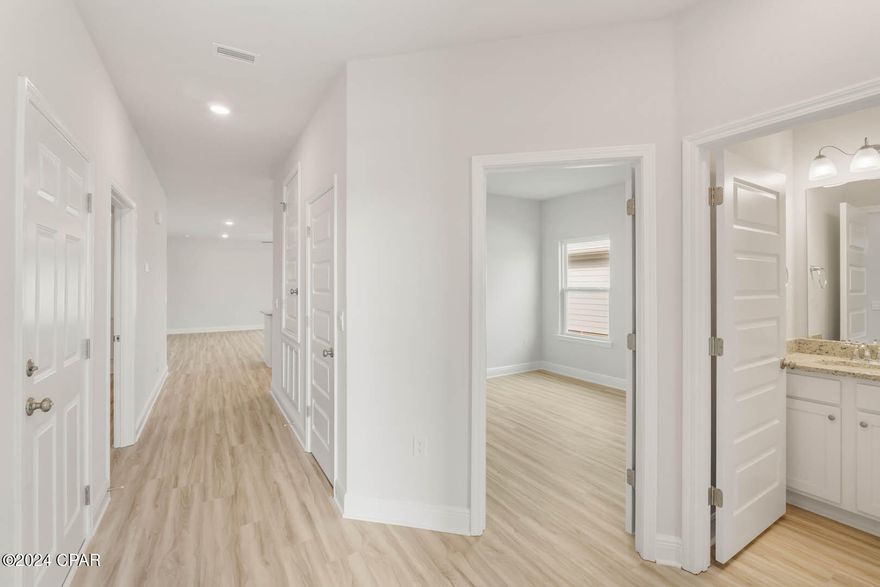 The Kennedy is a 4-bedroom, 3-bath home with 2197 square feet of living space located in WindMark Beach. Standard features of this home include beautiful quartz countertops with undermount sinks in the kitchen and all bathrooms, 5 panel wood doors, engineered vinyl plank flooring throughout the entire home and 9-foot ceilings throughout. Stainless steel appliances included are a free-standing smooth top range, microwave, and dishwasher. The kitchen features a large walk-in pantry, disposal and water filtration system. This unique floor plan features a mother-in-law suite complete with its own entrance, kitchen, bedroom, bathroom, heating and cooling and laundry. WindMark Beach is a tranquil community where one can enjoy the natural settings with boardwalks, walking paths, bike trails, and deeded beach access. WindMark Beach also offers residents numerous luxury amenities and features including a community pool, a gym, restaurants, packaging store/bar, beach equipment rentals, roving security, community fire pit, local shopping, and a versatile community center.