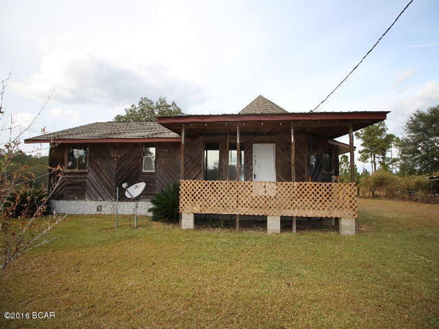 * PRICE REDUCED * Rustic cedar home in the country on 10 acres! There is a 24 x 48 barn, a 12 x 12 split log tack barn with 2 12'x12' lean-tos for storage. The home features an open airy design for the living, dining and kitchen area, It has 2 bedrooms and 1 bath and a large laundry room. It also has a wood front and rear deck. There is some fencing. Great place for horses!