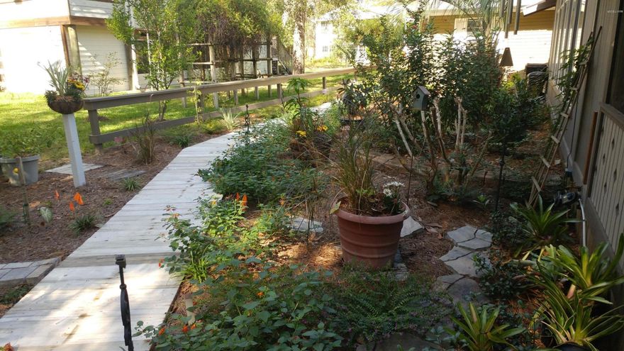 WATERFRONT fish camp on Bunker Creek.  Buy two homes for the price of one.  Large 1 bedroom cabin, full kitchen and custom cabinetry on large screen parch, overlooks your new 75feet seawall and the canal which leads to Choctawhatchee River and Bay. Enjoy the evening by the fire pit,or under the trellised gazebo.  Original home,used for storage, has all utilities connected for your dream home renovation, create a weekend retreat or full time homestead.  All landscape beds have automatic drip line system and new well pump and pressure tank recently installed.  Cabin front yellow.  Supra on Studio door. One key for cabin/one for storage house. Leave card on table.