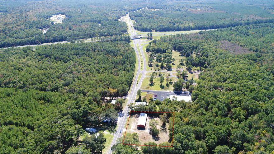 Located in a prime position on Highway 81, and just a stone’s throw away from Interstate 10, lies this fantastic commercial opportunity on 1.56 acres of very accessible and highly visible land in the heart of Ponce De Leon!

Offering 250 feet of highway frontage, this lot provides maximum exposure for your business! There are endless options to develop on this large, level and extremely versatile site. There is also a massive, 4,000 square foot warehouse which is perfect for overflow storage or could easily be converted to suit the needs of your business or headquarters. The property is serviced with road, public water and sewer access and is located in the Florida Enterprise Zone EZ-3001 which offers substantial tax benefits to employers – another financial incentive to invest in this thriving area!
Whether you choose to secure this prime land parcel to keep in the land bank for future return on investment, or use this excellent commercial property with it's fantastic exposure for your business â€“ this opportunity will not last long! Age, SF lot and room sizes are approximate. Please verify if important