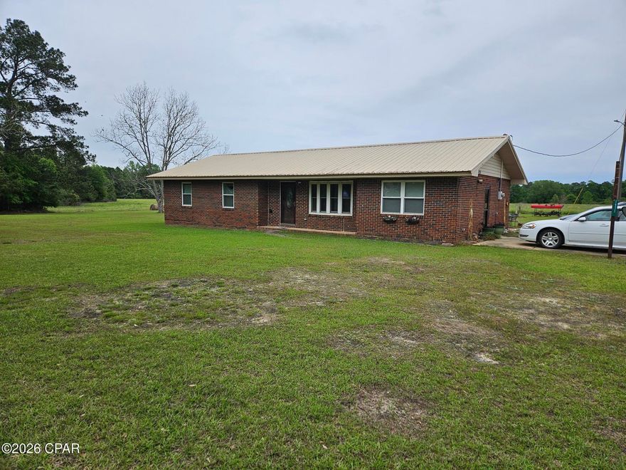 Very nice well kept home on a large private lot. A modest 3 bedroom home that has been very well taken care. Newly remodeled main bathroom as well as newer Kitchen cabinets and bar counter. Spacious living room and additional smaller den room. clean well built brick home with newer metal roof. Perfect starter home for a couple with 3 bedrooms with private master bath.  Very nice wooded additional acres leaving lots of opportunity for additional family member homes or possibly sell an acre or two to generate some extra cash. great spot just 10 minutes to Bonifay and I-10. Probate currently being conducted so possession might be a few months out. Nice large outdoor shed for what ever the new buyer desires. Interior and additional exterior pictures should be available in a week or so.