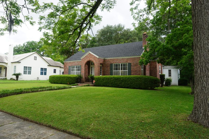 Beautiful HISTORIC HOME in downtown Marianna!  This 3 bedroom, 2 bath home has spacious rooms and a great floor plan. You will love the living room w/ original hardwood floors, barreled ceiling, and gas log unique fireplace!  It opens to the dining room which is perfect for entertaining or everyday casual dining, just off from the kitchen which has white cabinets, tiled flooring, & new appliances.  Off one of the bedrooms you'll find the most charming office area; complete with bookshelves. The hardwoods run through most of the home, and have been refinished. The owner has recently replaced the roof, put central heat/air, and repainted the home. It has a security system, and nice blinds on the large windows. The patio at the back entrance is the perfect spot to enjoy this backyard.