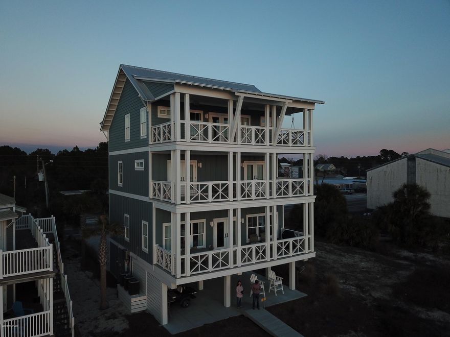 This is undoubtedly the nicest house you'll find from Mexico Beach to St. Joe Beach. It fared well in the hurricane & what damage it sustained has been repaired by the owner over the last 5 months and is in fantastic condition. Everything in this home is custom and top of the line. The high end finishes start in the foyer with high-end dirty top pine floors and well appointed elevator and are found from top to bottom with no expenses spared. You'll find Wolf appliances, marble countertops, designer lighting, and much more. The entire 4th floor is a master bedroom with sitting area and bath that's to die for with marble floors, soaking tub, huge closet, double tiled shower and more. Each floor has a large deck overlooking the Gulf. All bedrooms have en suite bathrooms and this home is being sold fully furnished and equipped as shown.