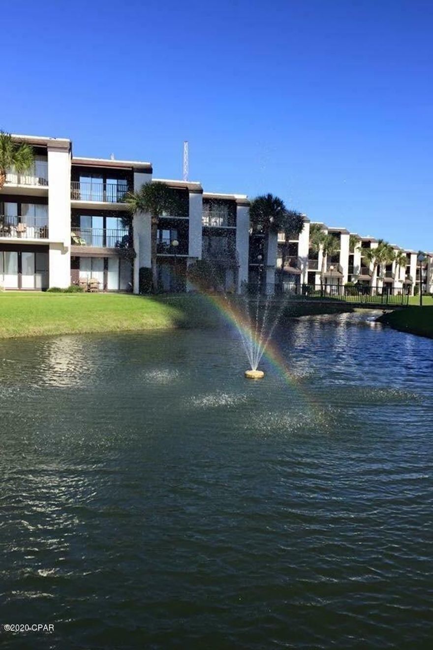 SUGAR BEACH ... CURRENTLY UNDER CONTRACT ... SELLER TAKING BACKUP OFFERS.  Well decorated 1 BR 1 BA Condo ... ground level ... opens onto courtyard and directly to the pool and beach. Situated on gorgeous well manicured low rise condo complex on Panama City Beach. Condo has new paint throughout, new sofa sleeper, loveseat, furnishings, shower & tile. Step out onto a fabulous view of the fresh water lake, fish turtles, new lighted tennis courts, new complex roof, shuffleboard, pool and club house, and more!!! New hurricane door/windows, washer/dryer and HVAC. Fantastic additions! There is also a large grilling area behind the club house. Steps from the pool and you are on the Beautiful Gulf of Mexico. PET FRIENDLY FOR OWNERS ONLY ... several dog walking areas.