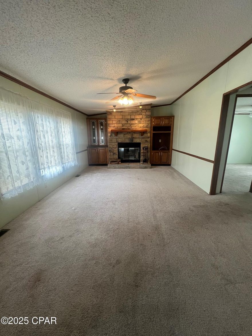 Turn key 3 bedroom 2 bath home on convenient lot. This split bedroom floorplan with living room and large separate den is perfect for a family, couple or rental. Large master suite with ensuite bath. Includes  Safe-Step walk in tub. Fenced lot with mature fruit trees and TWO workshops. This home was meticulously loved and it shows. Newer appliances and washer and dryer included in sale.
Very convenient access to Star Avenue and Tyndall Parkway. 10 minutes to Tyndall Airforce Base.