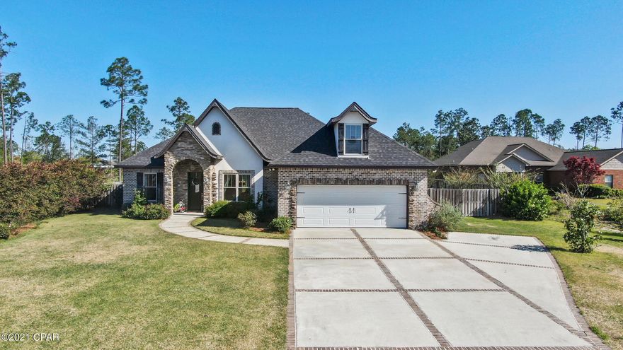 CURRENTLY UNDER CONTRACT, SELLER ACCEPTING BACKUP OFFERS. Come see this charming custom built Ben Wortman home in the quiet neighborhood of White Oaks. The 4 bedroom, 3 bath interior lacks nothing (BONUS room or 5th bedroom option)! You immediately enter into an open concept floor plan with 10ft. ceilings and 8ft. doorways with stained engineered hardwood floors throughout. The kitchen has stainless steel appliances, custom cabinets that extend to the ceiling, and beautiful granite countertops that are also used in all bathrooms. The master suite is truly an oasis with detailed trey ceilings, a spacious his and hers area and a spa like walk-in shower. OUTSIDE: An additional 700 sqft outdoor living area sits under the roof-line with an outdoor kitchen and beautiful brick columns. cooled and is surrounded by two toned pavers. Additional features to the outside is the outdoor accessible shower, as well as an OUTDOOR BATHROOM. Porch is built around the sun, you will not get any direct sunlight into the porch other than early morning. The home sits on .79 of an acre with a pole barn in the back with a 15 X 36 workshop attached. The home's exterior is a combination of brick and stone with detailed brick inlay around the windows and in the driveway to ultimately create a custom/cozy feel.  *** Custom built features to take note of is: the exterior walls of the home is built with 2 X 6s for extra foundational security, pure wood coffered ceiling in the dining room, and exposed wooded casing to the fire place.