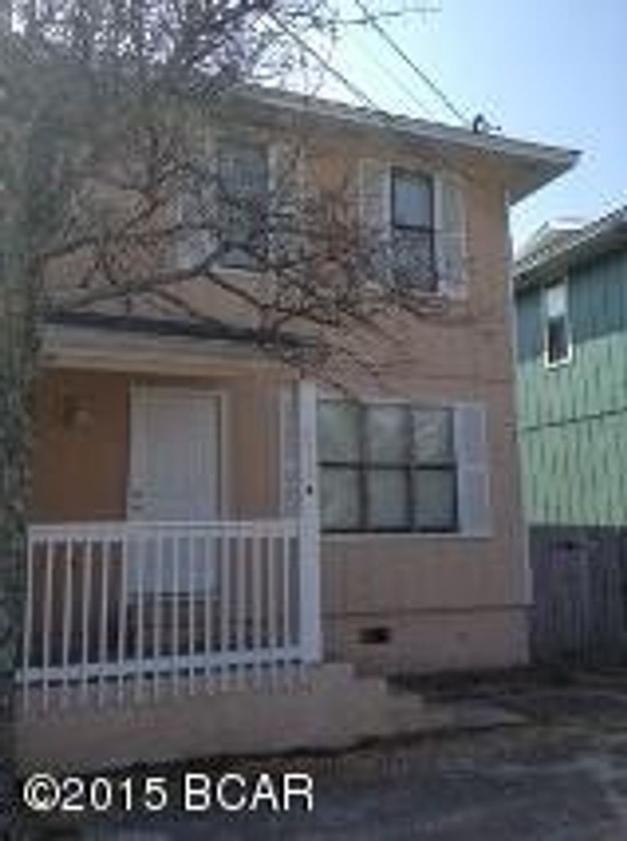 Just a short walk to the beach for this 3 bedroom 1.5 bath town home in the Thomas Drive area.  This home feature tile floors downstairs, open patio down stairs, and an open deck off of the 3rd bedroom.