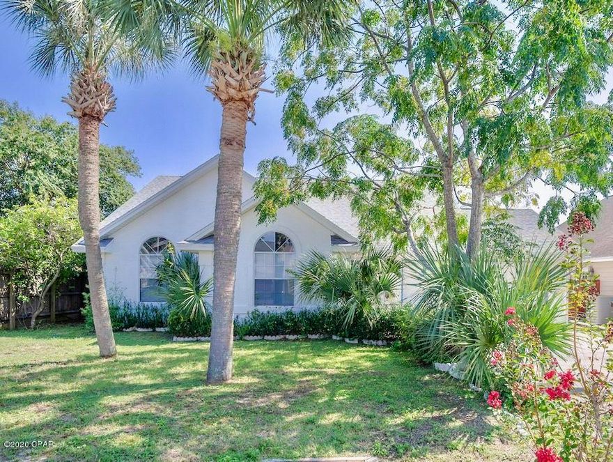 SEACLUSION BEACH...the name evokes images of a CHARMING SEASIDE COMMUNITY and beach bungalows, this one a FEW BLOCKS from the SUGAR SHORE of a GATED, ''DEDICATED BEACH'' accessed by code...and NO FEES! The home is tucked into a quiet, tree-shaded generous lot with FENCED YARD. The LIGHT-FILLED, OPEN PLAN showcases an array of ARCHITECTURAL DETAIL to include VARYING ceiling heights, ceiling styles, and UNUSUAL CURVED wall corners. The en-suite MASTER bath is complete with skylight, DOUBLE VANITY, LARGE SHOWER, and separate tub. A 10x25 FLORIDA ROOM has FRENCH DOORS. Other features include FIREPLACE, breakfast bar, outdoor shower, and grilling patio. GREAT SCHOOLS, LIBRARY, SHOPPING, DINING, and a COMMUNITY PLAYGROUND are nearby