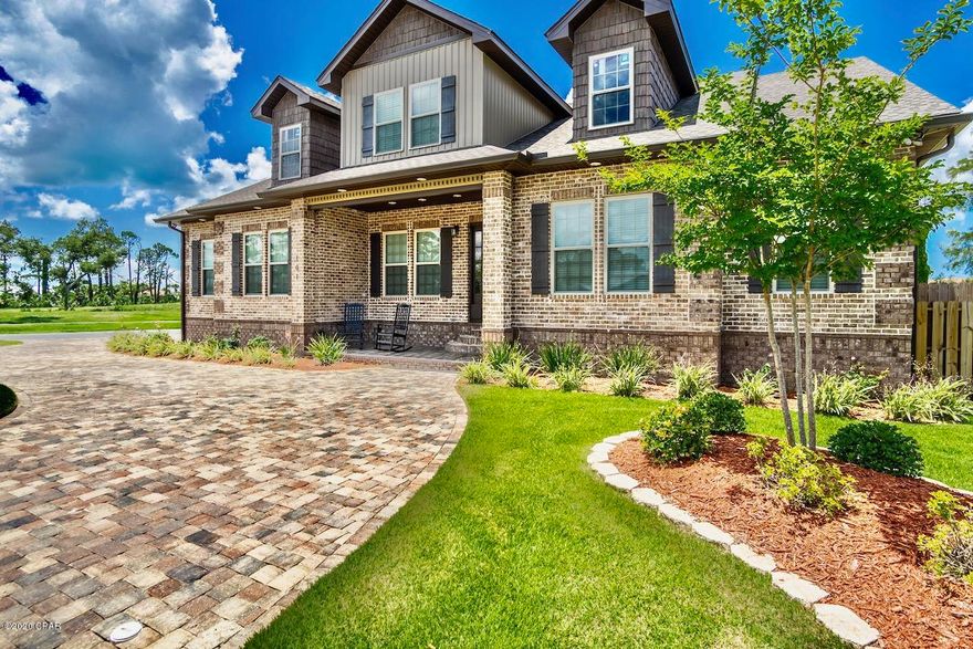 True craftsmanship at its finest. This all brick, 7 bedroom, 4.5 bath home is a rare opportunity that you'll absolutely want to view in person. Located in one of the most sought after area's in Panama City Beach, this 4,000+ sq.ft home is stunning inside and out. Not only are the upgrades and details countless, being located on a large corner lot with a pool and outdoor kitchen make this the perfect home.

Just a few of the upgrades include a wine cellar, built-in cabinets, brick paver driveway, beautiful landscaping, high-end lighting, a dream kitchen, custom tile work, and so much more!! If you have a large family and/or love to entertain, this home couldn't be a better fit. If you appreciate quality, you'll appreciate every inch of this custom built home. You're also less than 2 miles to a public beach access.