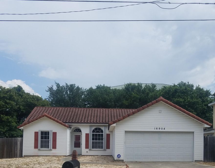 Here is your ''Beach House'' just blocks from the Beach & about 1 mile to Pier Park. Golf cart community for fun rides to both. Updated home with stainless appliances, new cabinets & counter tops. Newly painted & carpeted bedrooms. All other floors are hardwood & tile. All windows & doors have permanent hurricane shutters installed. Beautiful master bath w/walk-in tile shower, vessel sink, & walk-in closet. Cathederal ceiling make this home very open. Kitchen & DR open to LR. New french doors going out to covered deck in back yard.  Also completely fenced back yard. This baby won't last long.