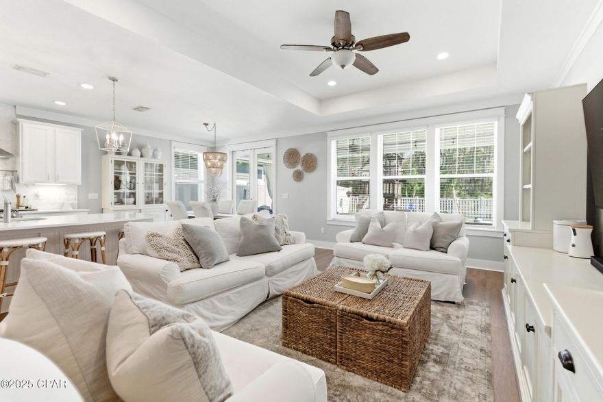 This 3BR/2BA Craftsman-style Samuel Taylor home in Breakfast Point offers a quiet, green backdrop just minutes from the beach and amenities. Designed with both comfort and style in mind, the open floor plan feels bright and spacious with 9- and 10-foot ceilings and a recessed ceiling detail in the living area. The modern kitchen features white cabinetry, quartz countertops, a herringbone tile backsplash, stainless appliances including a gas range with vent hood, and a large island with bar seating — ideal for both cooking and gathering.

Luxury vinyl plank flooring adds a clean, low-maintenance finish throughout the main spaces, complemented by tile in the baths and plush carpet in the bedrooms. The primary suite includes a walk-in closet, dual vanities, and an oversized tile shower. Two additional bedrooms and a full bath with a tub/shower combination offer flexibility for family, guests, or a home office.

A separate laundry room adds convenience, while the extended covered patio overlooks a backdrop of lush conservation land - providing peaceful privacy and no rear neighbors. Built above hurricane code with 2x6 exterior framing, tie-down rods, and upgraded insulation, this home blends lasting quality with timeless appeal.

Breakfast Point is known for its quiet, convenient lifestyle - surrounded by wooded conservation land yet close to the beach, Pier Park, and Frank Brown Park. Daily errands are easy with Publix, schools, restaurants, and other shops/services nearby, and the golf cart-friendly community makes getting around a breeze. 

Discover the comfort, location, and lifestyle that make this Breakfast Point home a standout — schedule your private tour today.