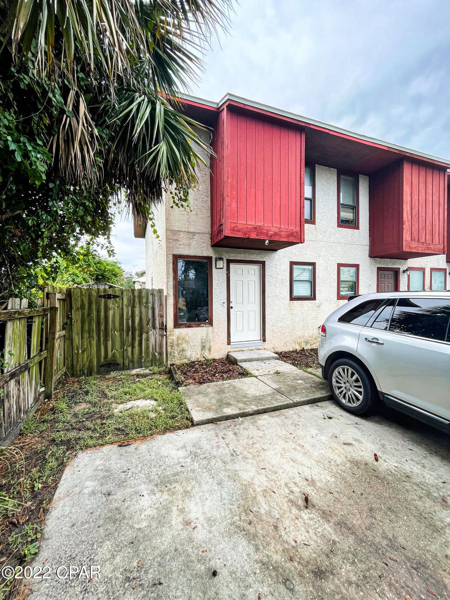 CURRENTLY UNDER CONTRACT, SELLER WILL CONSIDER BACKUP OFFERS! INVESTOR and FIRST-TIME HOME BUYER ALERT! This is an empty, 2 bedroom 1 ½ bathroom end unit with NO HOA located minutes away from St. Andrews, Gulf Coast State College, and the beautiful Panama City Beach. This unit has a fenced-in yard for great privacy. This unit also features new paint, new floors, a brand-new bathtub, new windows, a new sliding glass door, a new water heater, a new HVAC motor, and a cleaned-out evaporator coil, making this a must-see! The listing agent does have an ownership interest in the property.